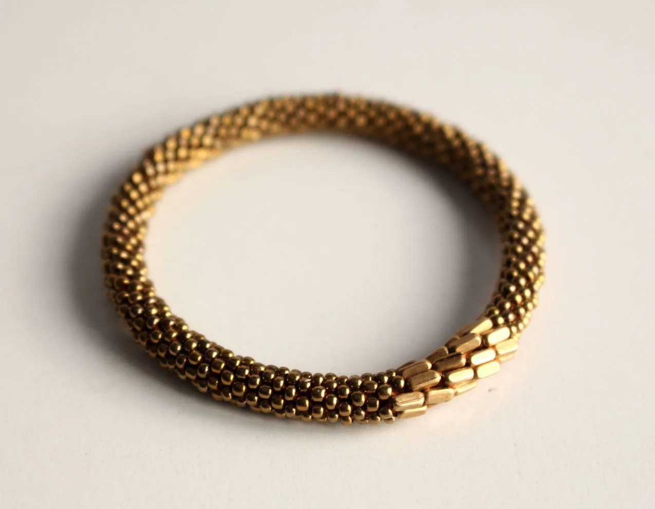 Stylish Golden Metal Crocheted Beads Roll On Bracelet